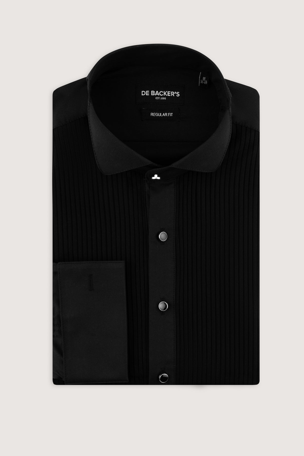 A folded black long-sleeve dress shirt with a subtle vertical stripe texture, featuring a solid collar, button-down front, and a chest pocket, presented on a light gray background. The brand name 'DE BACKER'S' is visible on the inner neck label.